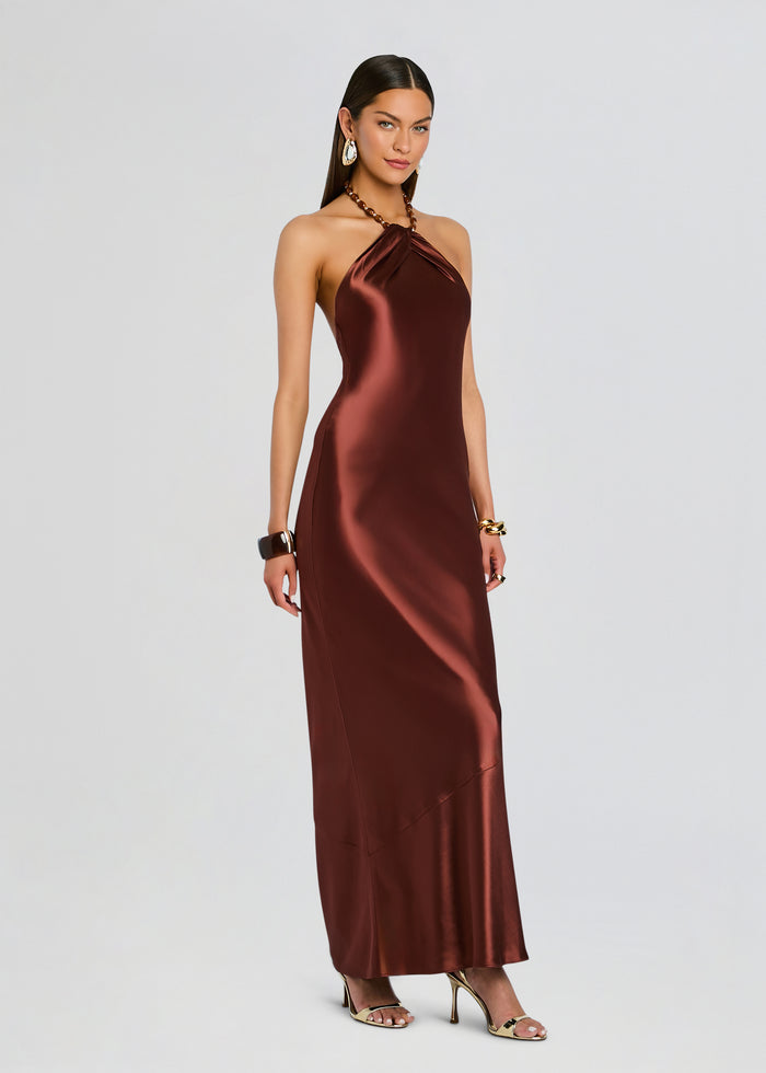 Anat Dress in bronze satin on a model with a twisted halter neckline and long flowing skirt media 3 of 5