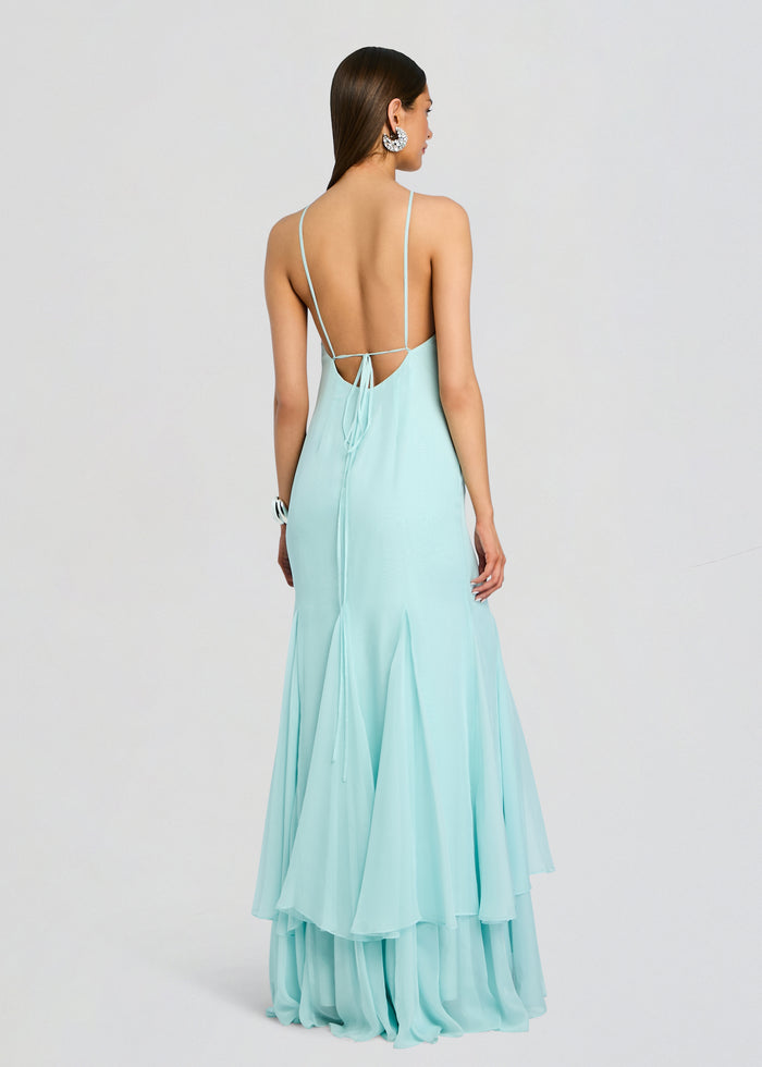 Back view of the pale blue Lirael Chiffon Dress with delicate straps and a tied open back, flowing layered hem. media 4 of 5