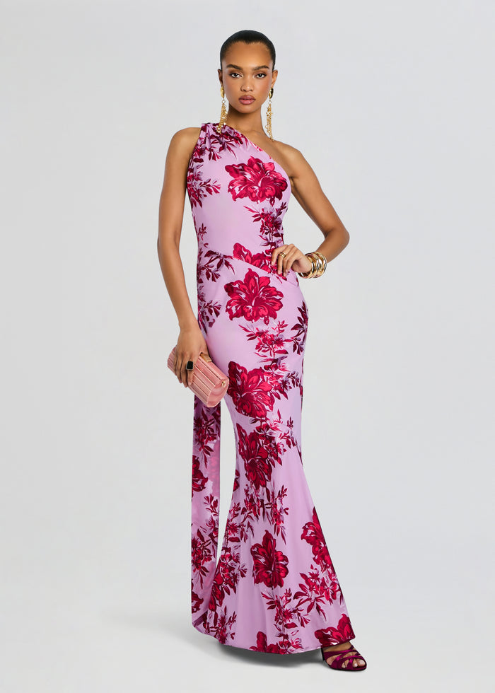 Lorenna Dress pink floral gown with a one-shoulder neckline worn by a model holding a pink clutch media 3 of 5