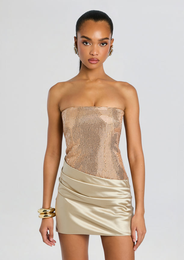 Front view of the Marieta Embellished Dress featuring a copper-toned sequined strapless top and champagne satin mini skirt.