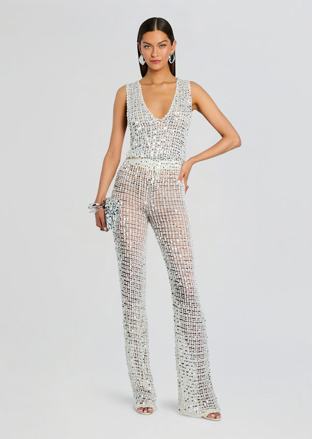 Silver sequin crochet jumpsuit with a deep V neckline and wide-leg pants