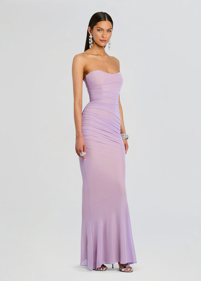 Model wearing a strapless lavender Quintessa Mesh Dress with ruched bodice and a floor-length skirt media 3 of 5