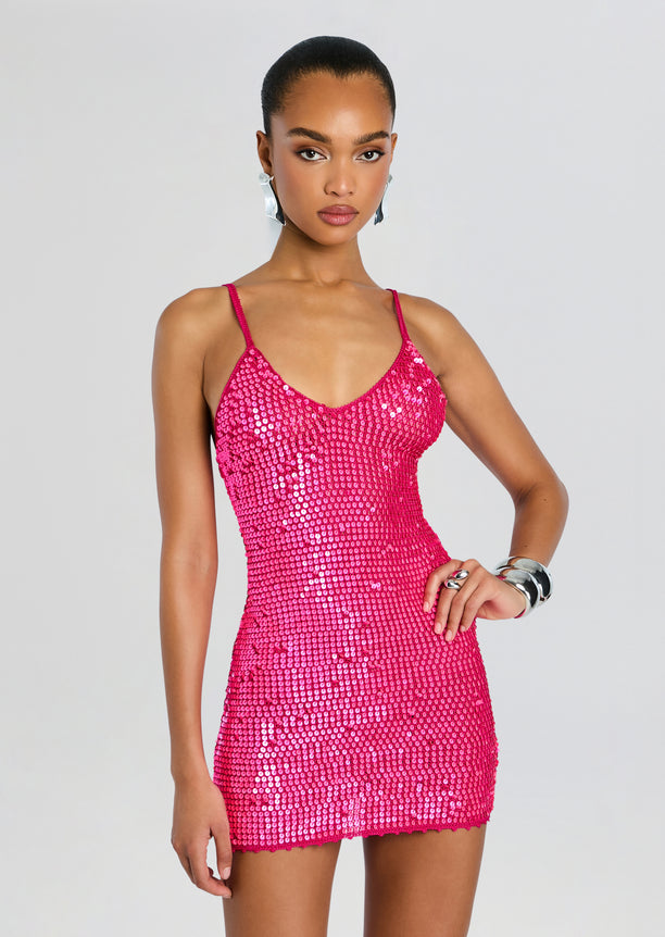 Close up of model in hot pink sequin crochet mini dress with a V neckline and thin straps