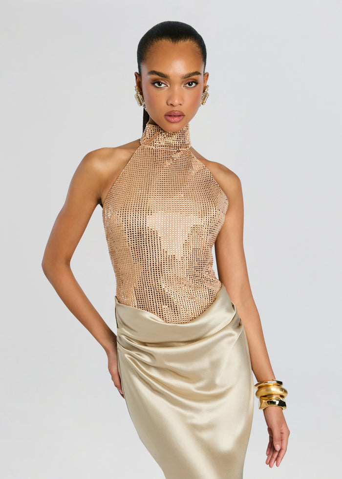 Front view of a model in a Vanya Embellished Dress featuring a sparkling mesh halter top and champagne satin skirt media 6 of 6