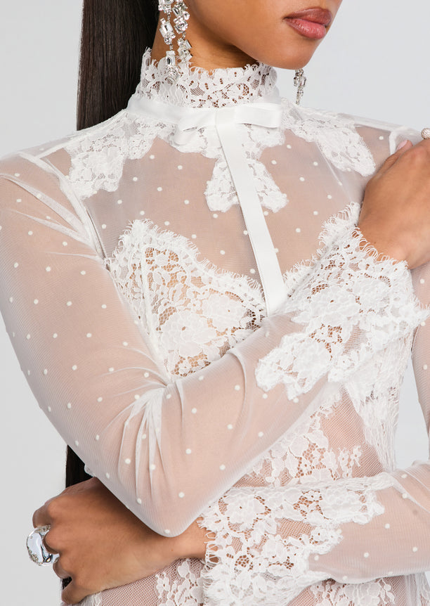 Close-up of Faylin Lace Dress bodice with floral lace and sheer dotted mesh high collar.