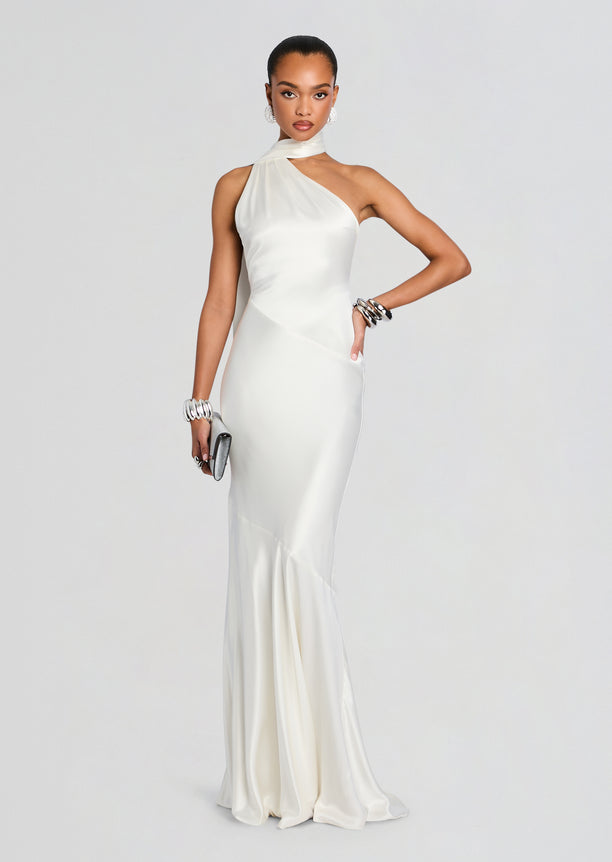Kelsa Dress full-length white satin gown with one-shoulder neckline and flowing skirt with a fringe cape