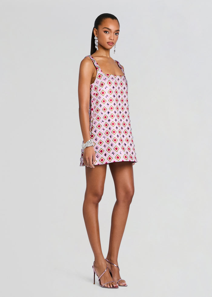 Zephyra Embellished Dress on a model in pink geometric print sleeveless mini dress with square motifs and strappy heels media 4 of 6