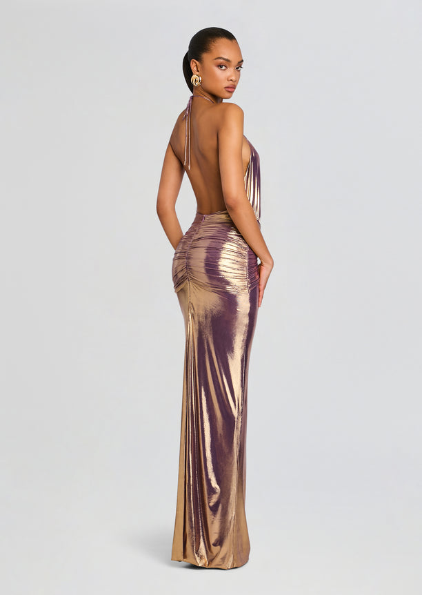 Back view of Nolira Dress featuring a low open back with halter ties and a ruched metallic gradient skirt.