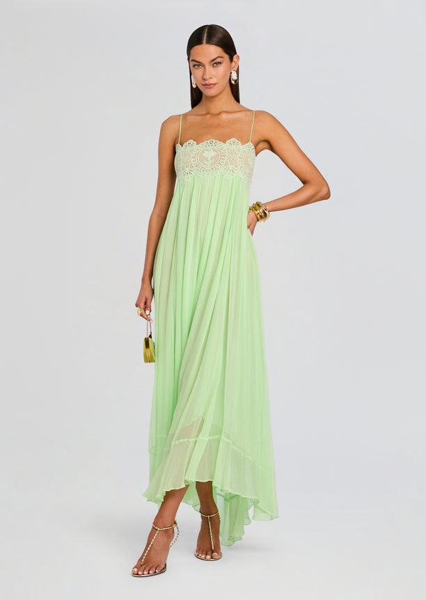 Model wearing mint green Gypsy Chiffon Dress with a lace bust, thin spaghetti straps, and flowing chiffon skirt