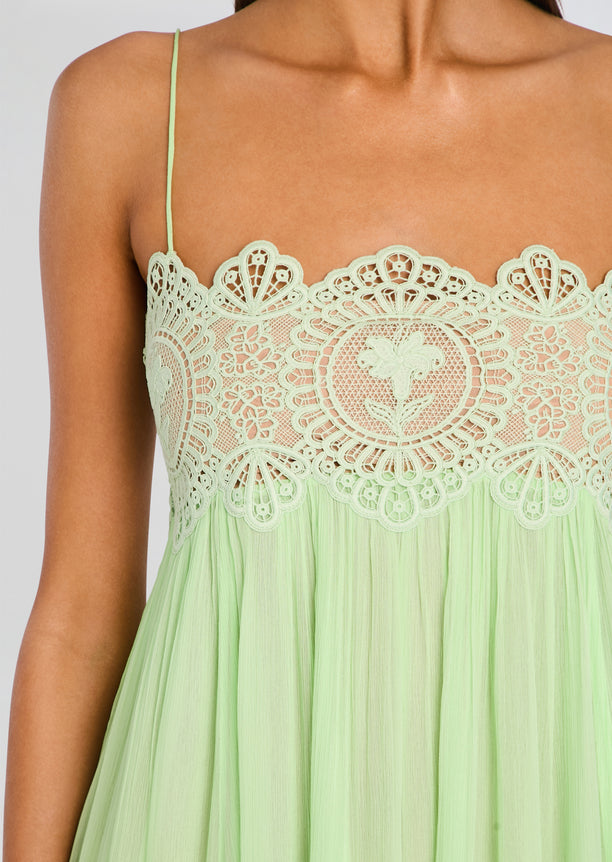 Close up of mint green lace bodice on Gypsy Chiffon Dress showing intricate floral pattern and thin strap