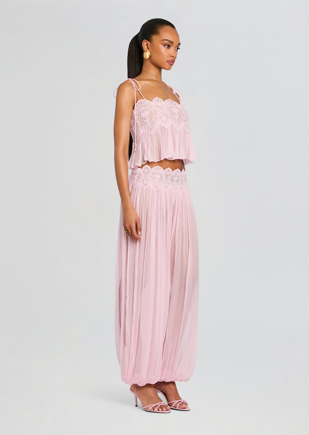 Full length shot of model wearing the Luenie Chiffon Top with matching pink lace skirt and sandals