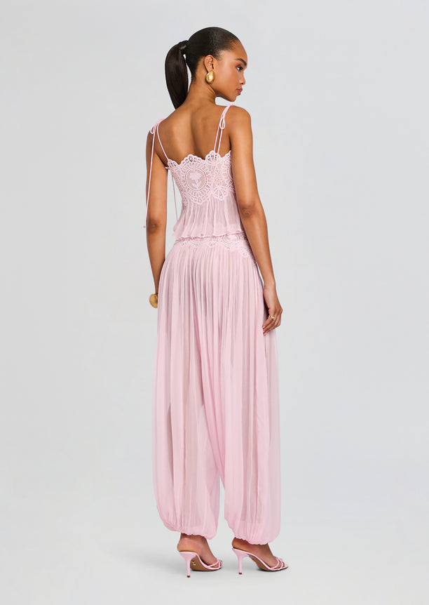 Back view of a model wearing a pink Luenie Chiffon Top with lace bodice and matching chiffon pants.