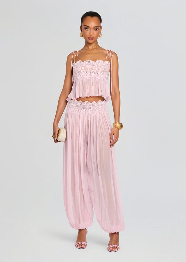 Front view of a model wearing a pink Luenie Chiffon Top with lace bodice and matching chiffon pants.