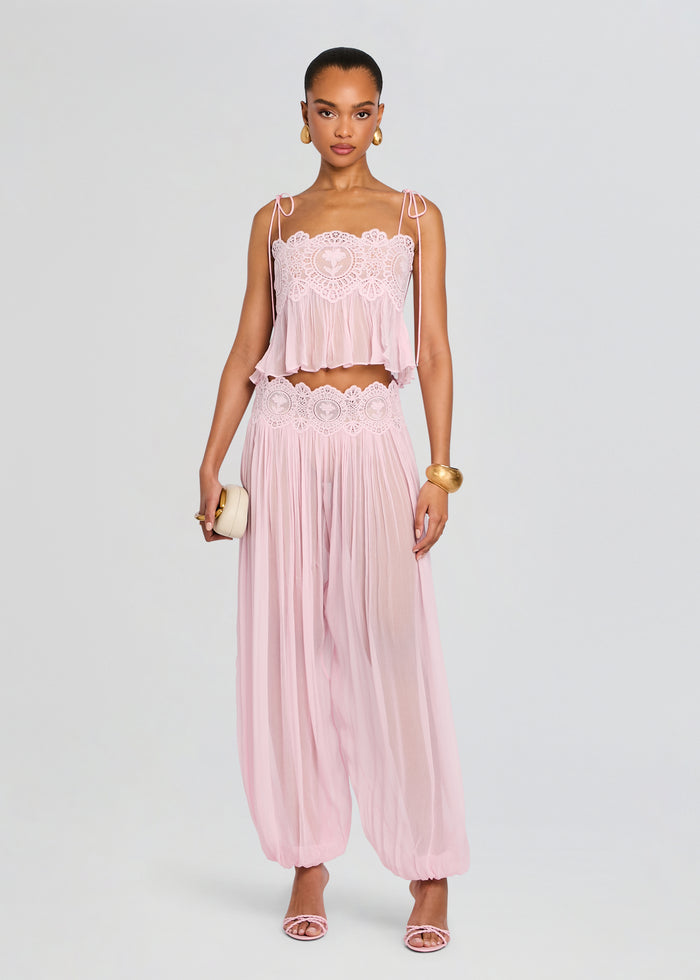 Front view of a model wearing a pale pink Dreamy Chiffon Pant set with lace crop top and wide chiffon pants media 6 of 6