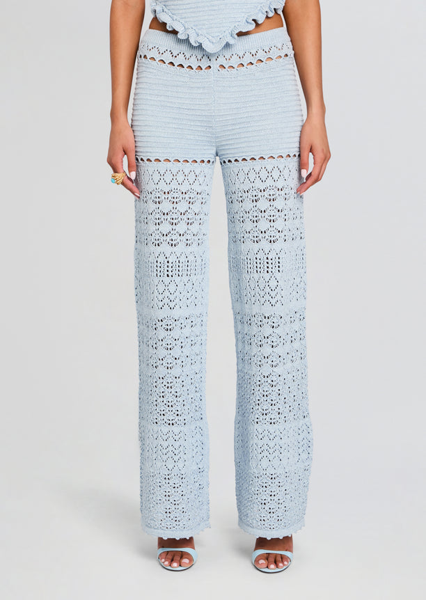 Light blue crochet pants with wide legs and lace panels at the waist and lower legs