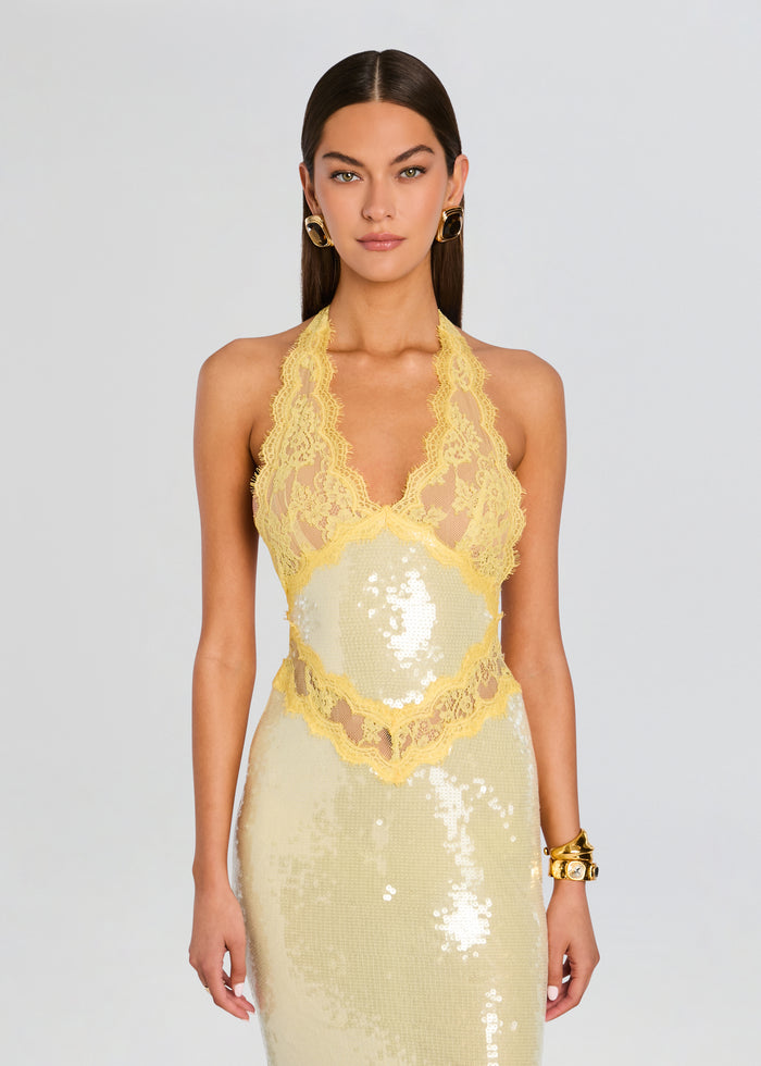 Front view of a pale yellow sequin dress with intricate lace trim and halter neckline media 6 of 6
