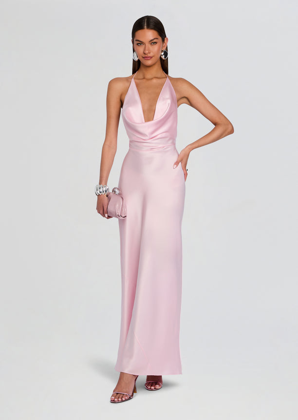 Pink satin Cinque Terre Dress on a model with a halter neckline and floor-length skirt