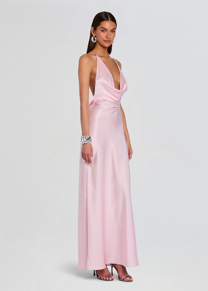 Side view of the pink satin Cinque Terre Dress on a model showing the draped waist and full-length skirt media 3 of 5