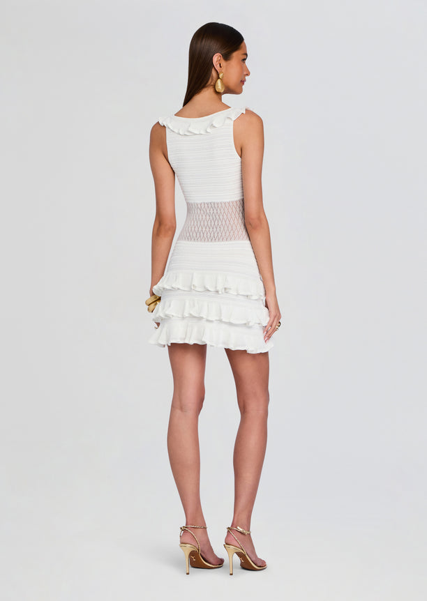 Costera Dress back view showing a sheer lattice waist panel and layered ruffle skirt.