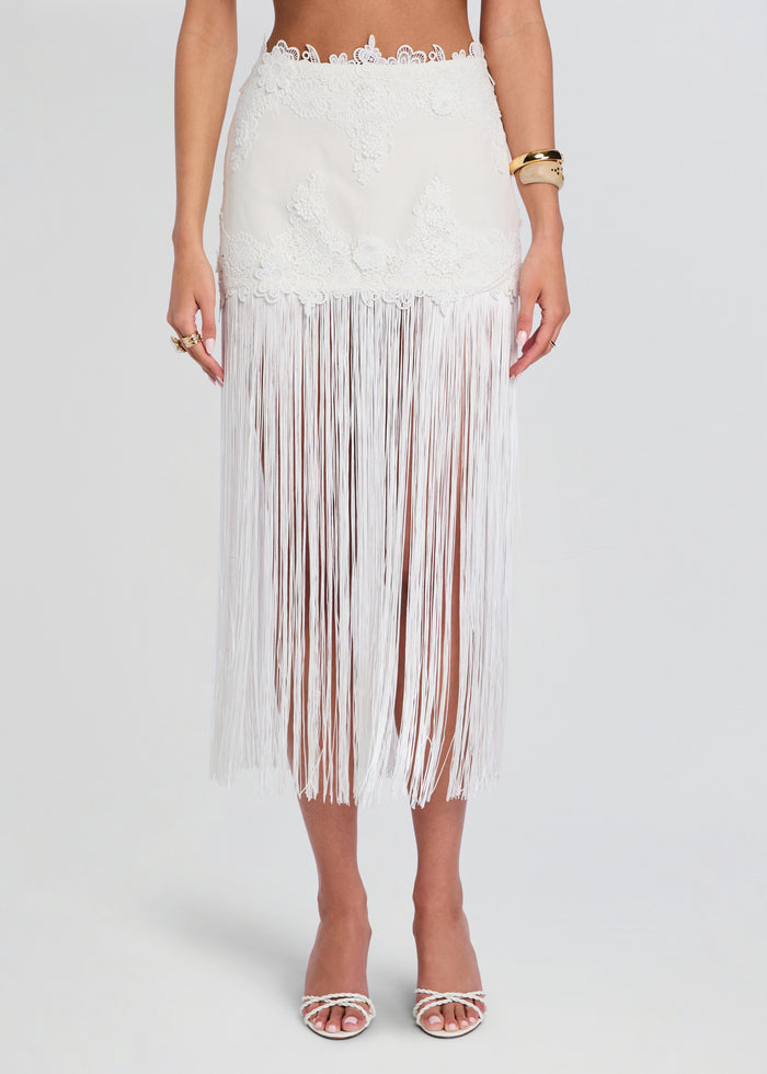 Close up of the Amaris skirt waist showing floral lace pattern and long white fringe media 1 of 5