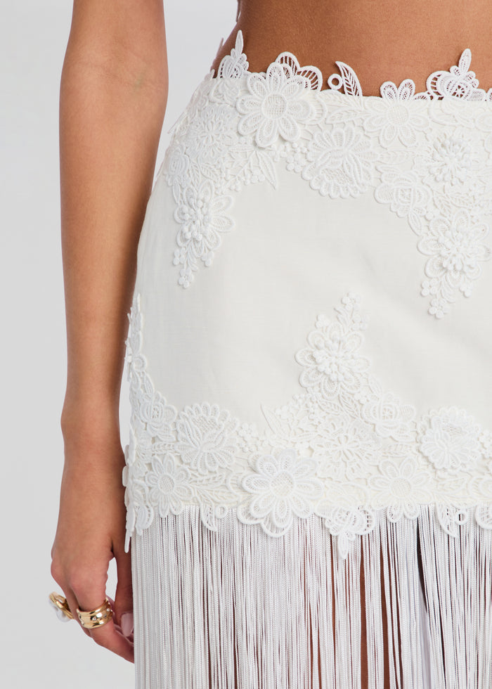 Amaris Skirt close up of white lace with floral appliqués and fringe hem media 3 of 5