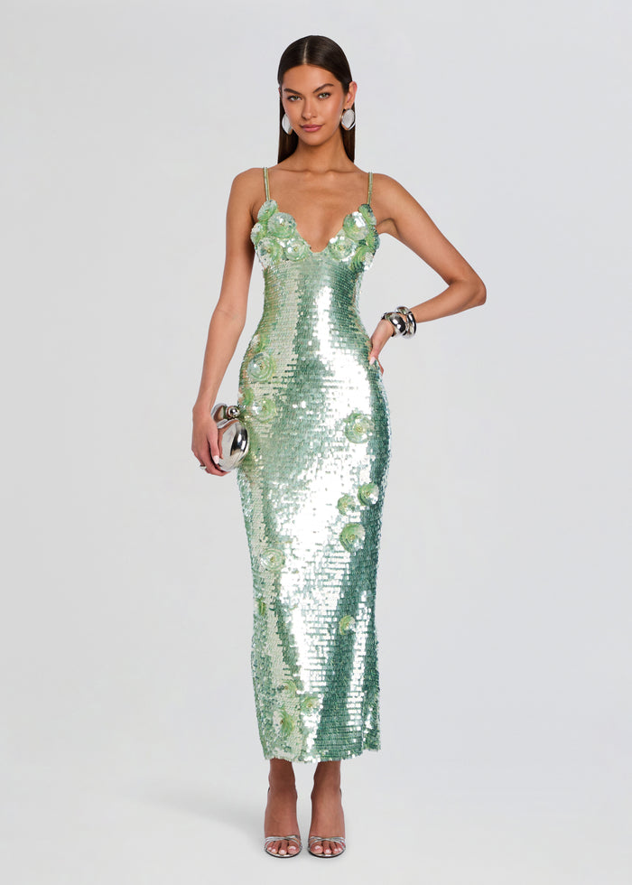 Model in a mint green sequin gown with three dimensional floral appliques along the bodice and skirt. media 1 of 5