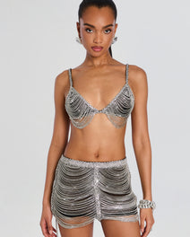Model wearing Jetta Chain Bra set with crystal fringe bra and matching beaded mini skirt.