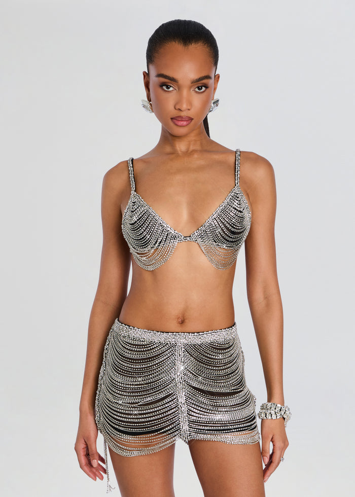 Model wearing Jetta Chain Bra set with crystal fringe bra and matching beaded mini skirt. media 1 of 5