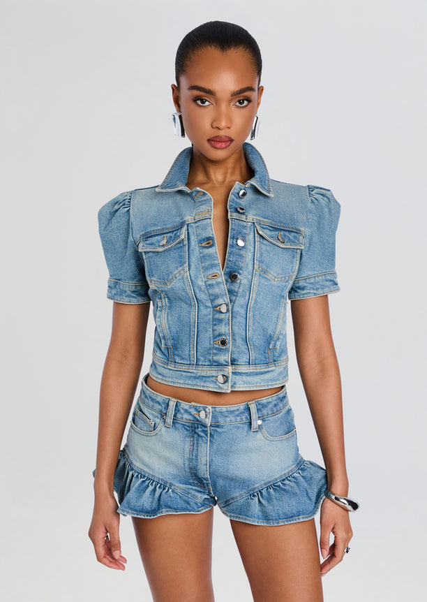 Landon Denim Jacket cropped light wash with puff sleeves and front pockets on model