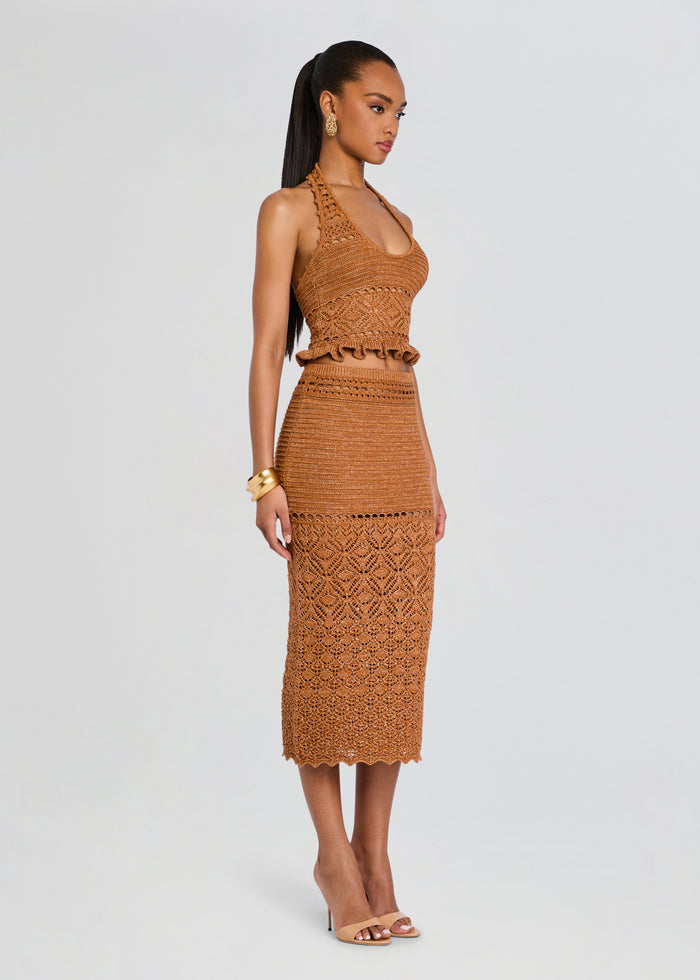 Model wearing Leony Crochet Skirt with matching crocheted top, midi length skirt, and nude heels. media 4 of 5