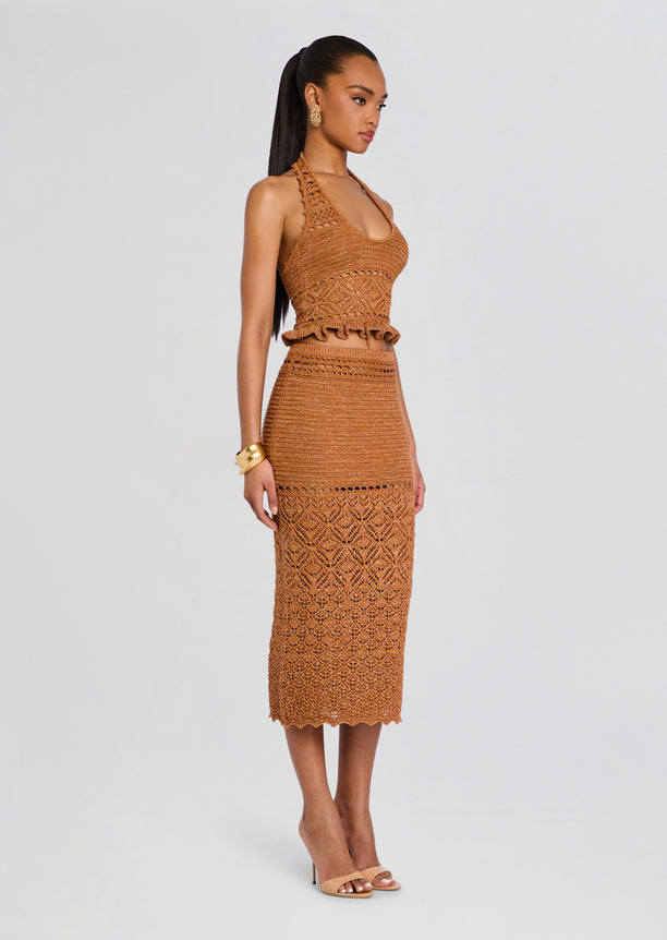 Model wearing Leony Crochet Skirt with matching crocheted top, midi length skirt, and nude heels.