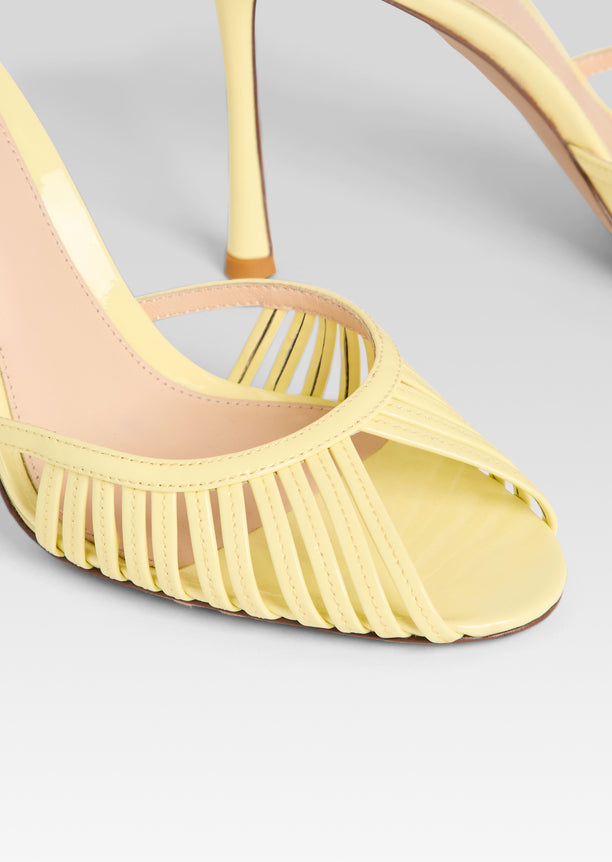 Close-up of pale yellow Allistair Sandal front showing slender woven straps across the toes