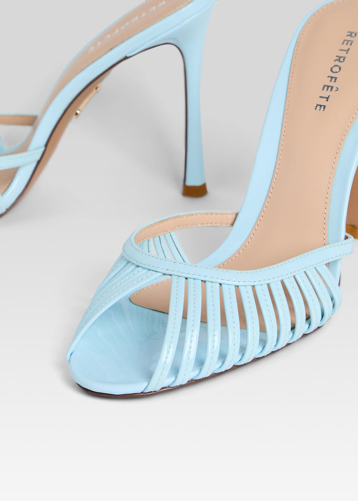 Close-up of light blue Allistair Sandal showing woven front straps and beige footbed media 3 of 5