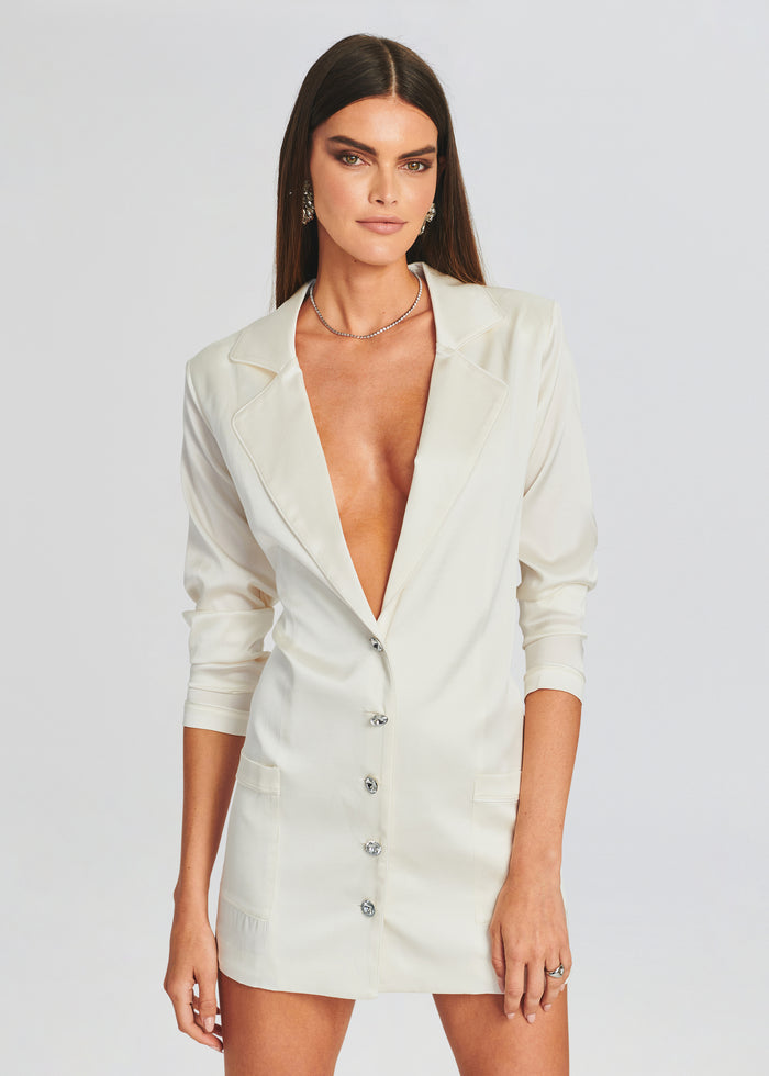 White tailored blazer dress with a plunging neckline and front button closure. media 1 of 3