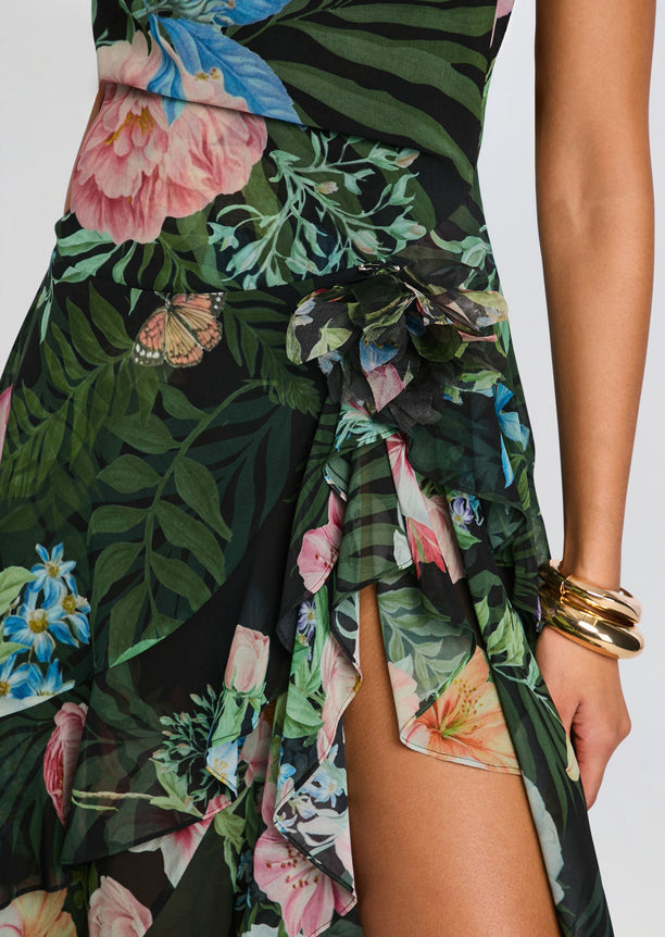 Close-up of the waist on Samara Silk Chiffon Dress showing a floral bow and layered ruffles in tropical print.