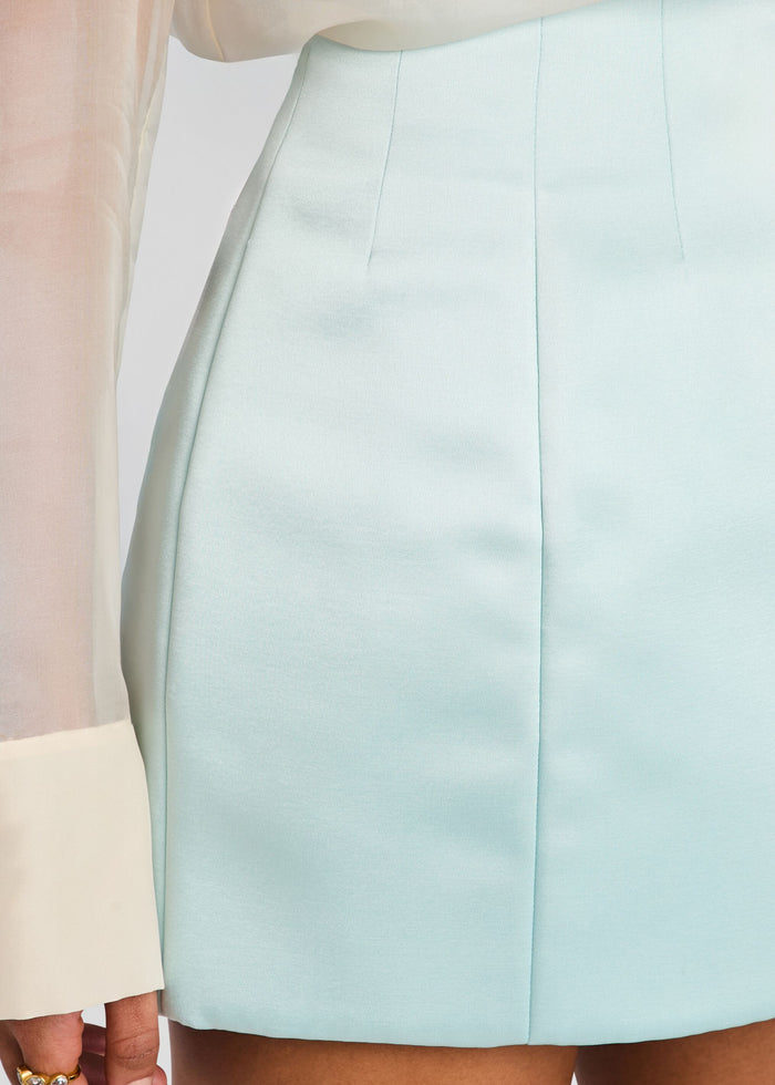 Close up of pale blue Asta skirt showing clean front seam and tailored fit. media 3 of 5