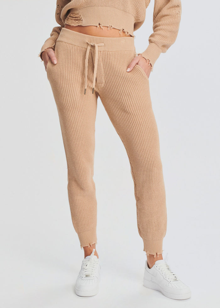 Beige knitted Ida Jogger shown with a cropped sweater and white sneakers media 1 of 4