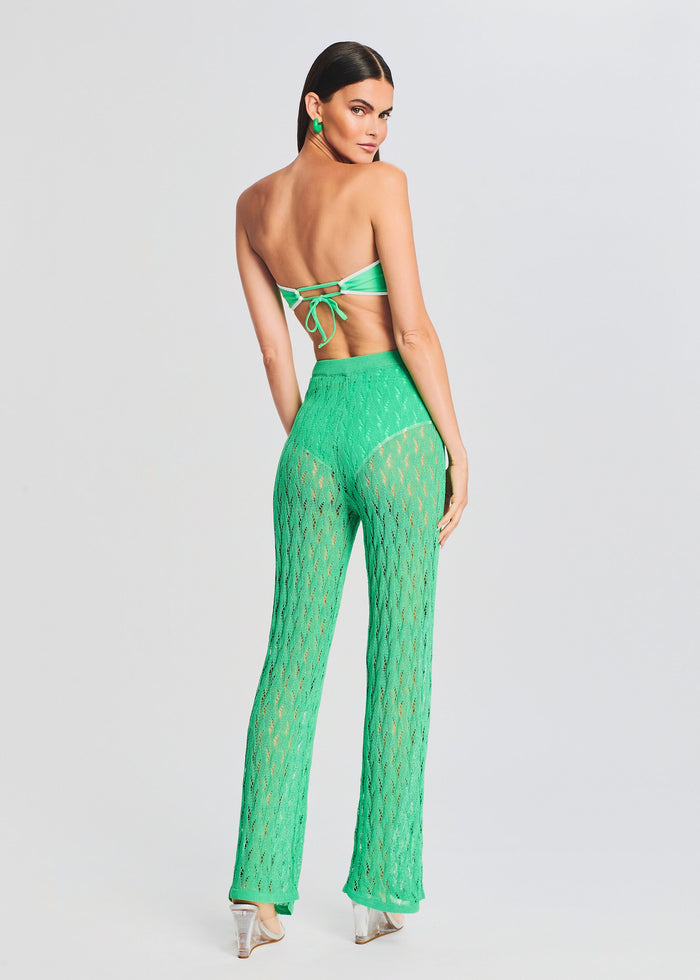 Back view of a model in neon green Dylan Knit Long Pant with a matching bandeau top tied at the back. media 4 of 5