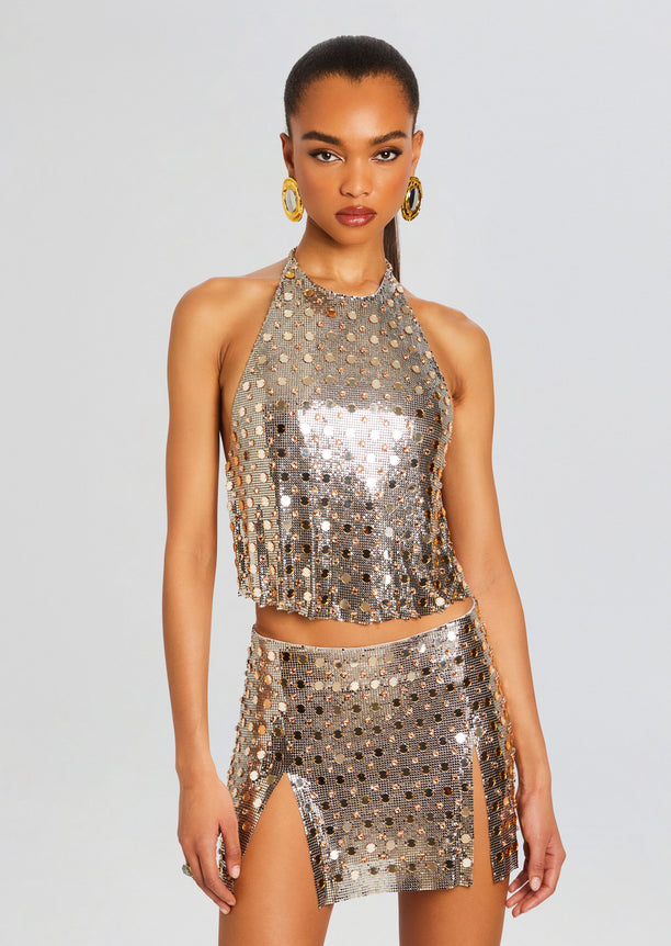 Kylo Top metallic silver halter crop top encrusted with round mirror sequins and a fringed hem.