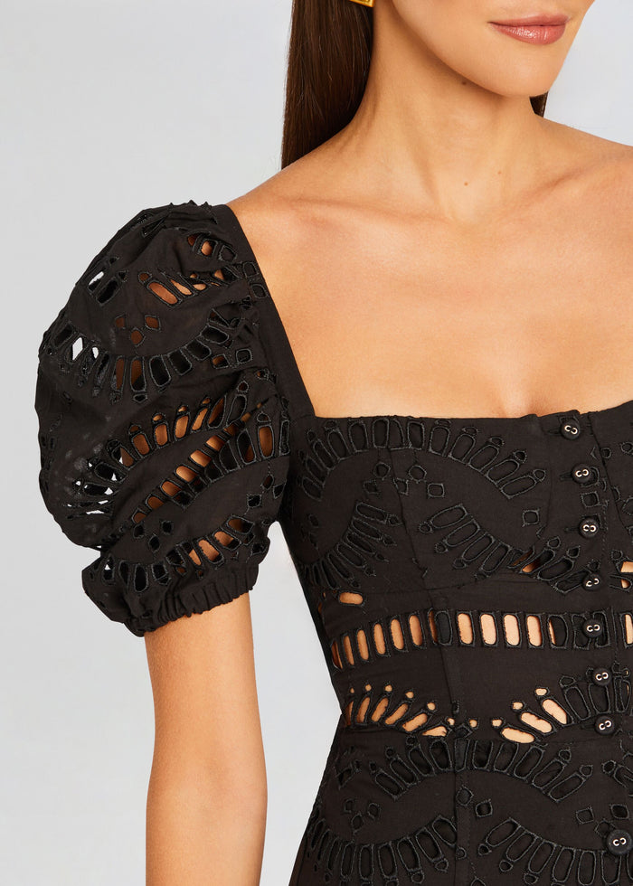 Spiana Long Dress bodice close-up showing black eyelet cutouts and puff sleeves media 2 of 5