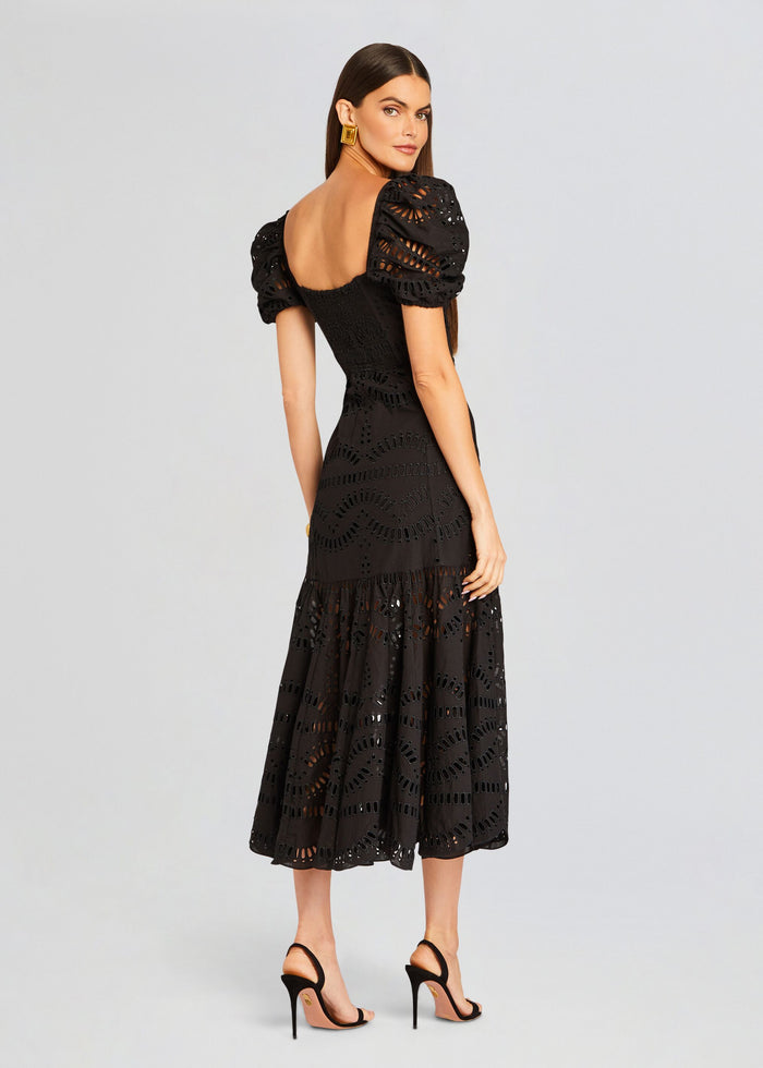 Back view of Spiana Long Dress on a model with open back and puff sleeves media 4 of 5