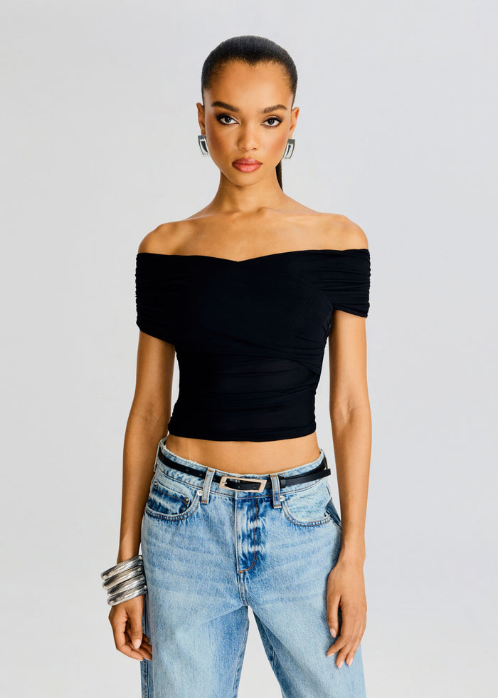 Black Aruba Mesh Top off the shoulder cropped style on a model wearing light denim jeans media 1 of 5