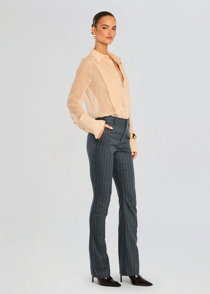 Model wearing Jemma Silk Blouse in peach tucked into dark pinstripe trousers, showing the relaxed fit. media 4 of 6