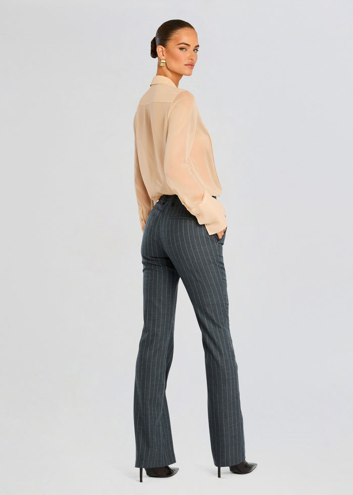 Back view of peach Jemma Silk Blouse on model, sheer long sleeves and classic collar. media 5 of 6