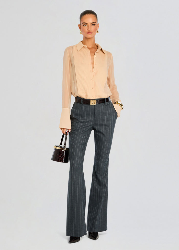 Model wearing Jemma Silk Blouse in peach sheer silk with a collared neck and button-down front. media 6 of 6