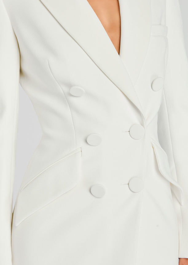 Close-up of the Amberly Blazer Evening Dress shows a white tailored blazer with round buttons and structured lapels.