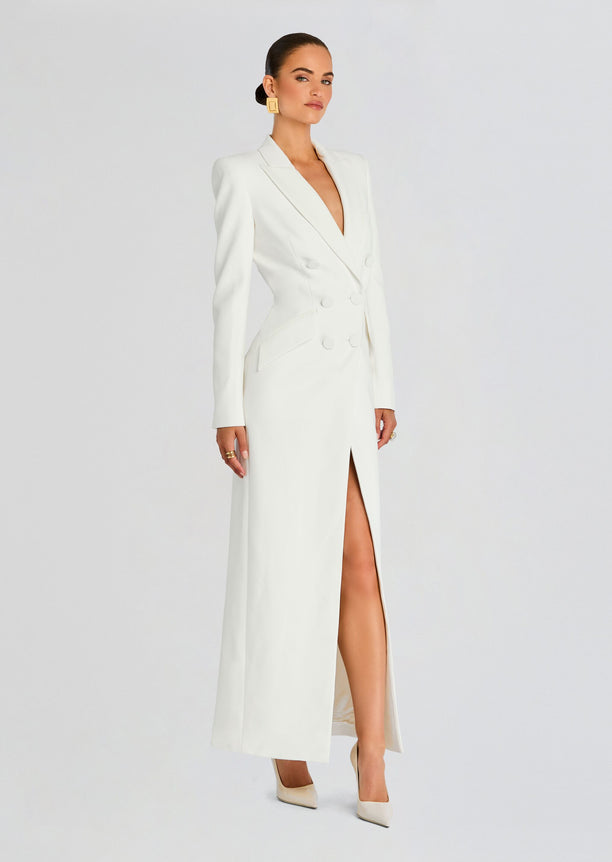 Model wearing the white Amberly Blazer Evening Dress with a deep V neckline and thigh-high slit.