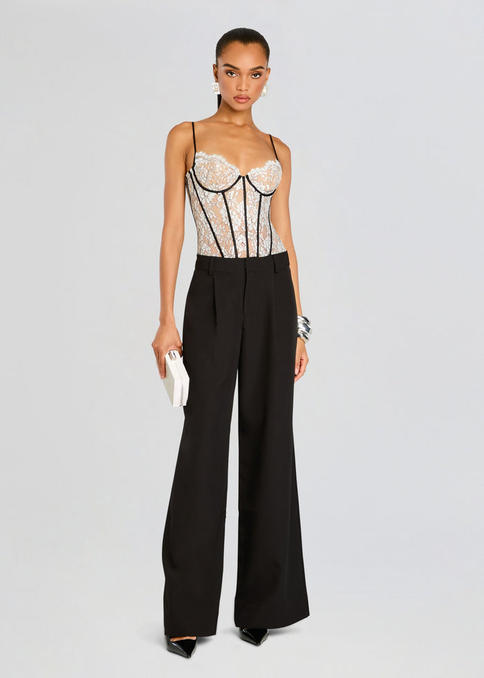 Front view of Lovisa Corset Bodysuit with beige lace cups and black vertical seams, paired with black wide-leg trousers. media 5 of 5