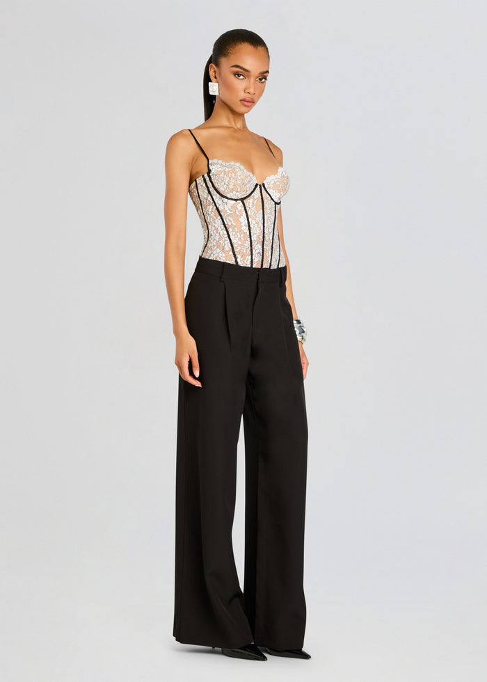 Model wearing Lovisa Corset Bodysuit with lace bodice and black wide-leg pants. media 3 of 5