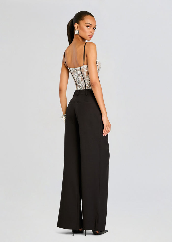 Back view of model in Lovisa Corset Bodysuit with lace panels and black wide-leg pants. media 4 of 5